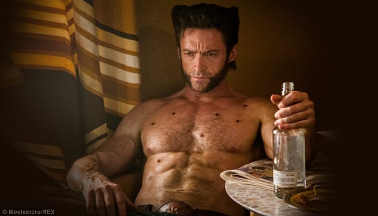 Image of Wolverine with gunshot wounds drinking alcohol