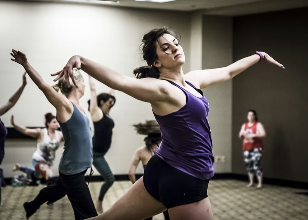 Students dance in a workshop.