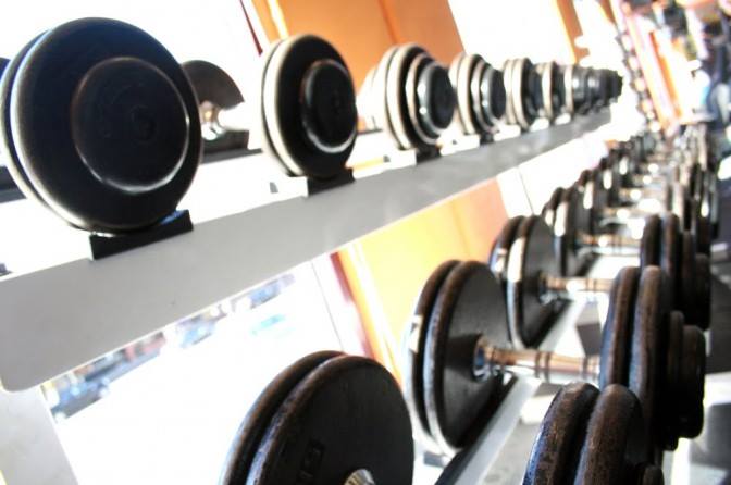 Close up of stacked free weights.