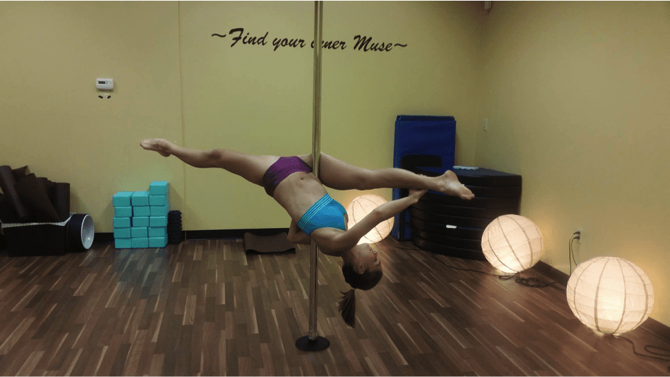 Pole dancer demonstrates a Jade Split.