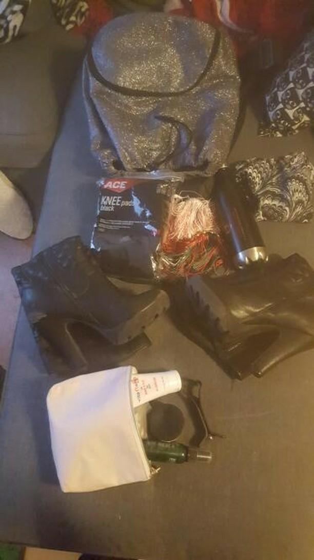 Contents of a pole bag, water bottle, boots, knee pads