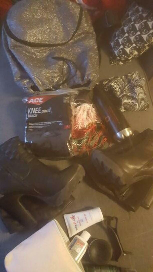 Pile of contents from a pole bag, knee pads, grip aid, etc.