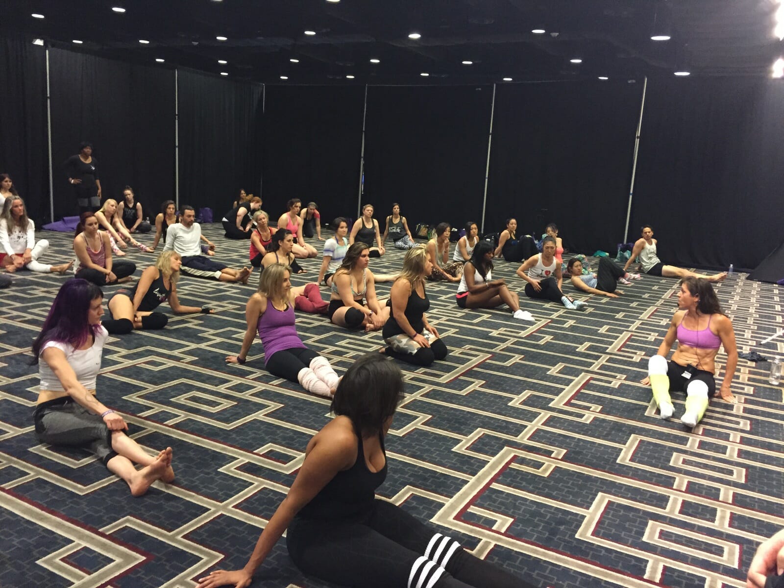 people sitting on the floor during a workshop