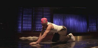 Dancer crawls across the floor