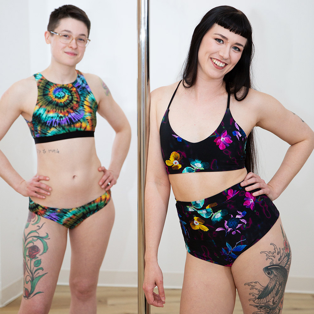 Two people model Synchronicity Active apparel.