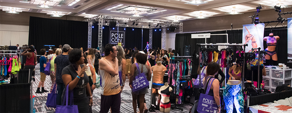 Image of PoleCon vendor floor and stage area from 2017 event.