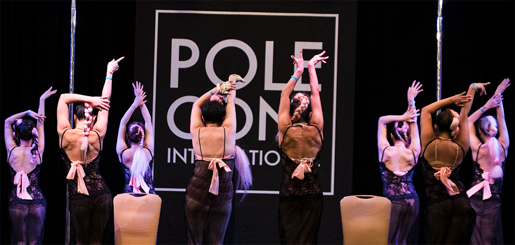 A troupe performs at PoleCon 2018