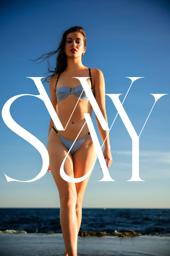 Woman in front of a beach scene with word "Sway"