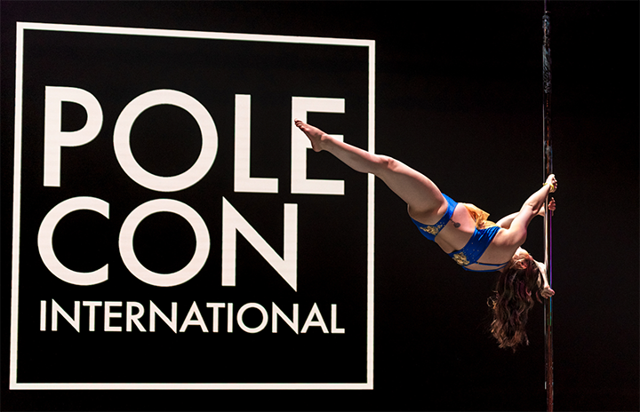 Kelly does a Russian Split pole move at PoleCon 2025
