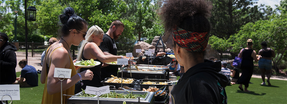 Photo of people eating from the buffet at PoleCon 2019